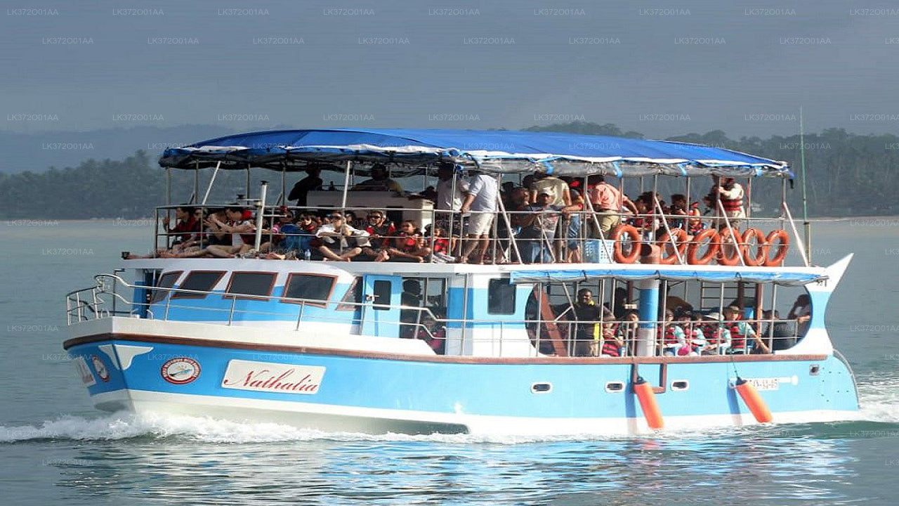 A boat full of people heads out to sea for a whale watching tour in Hikkaduwa, Sri Lanka.