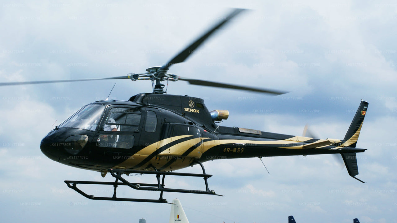 Helicopter flying against a cloudy sky