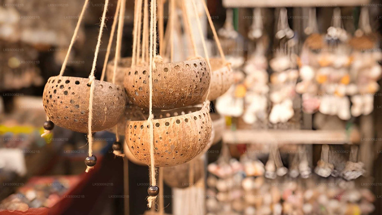 Hanging ceramic pots with a blurred market background